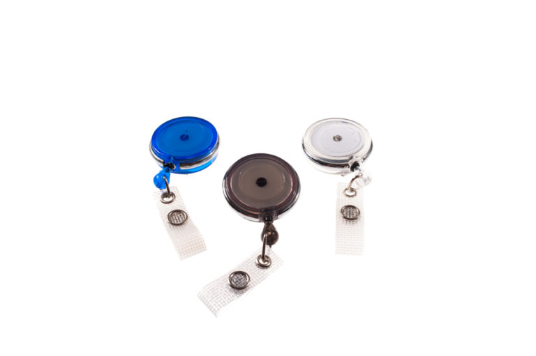 Badge reel with revolving belt clip